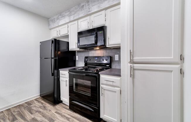 a kitchen with a stove top oven sitting inside of a refrigerator