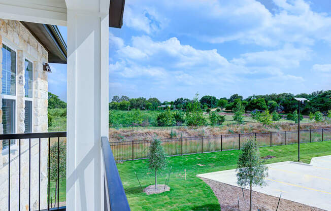 the view of the yard from the balcony of a house at Legacy at Cibolo, Boerne, 78006