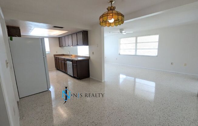Large open 2/2/1 1378 Sq. Ft. with freshly finished floors, fresh paint, new appliances and located near the heart of Downtown New Port Richey!!
