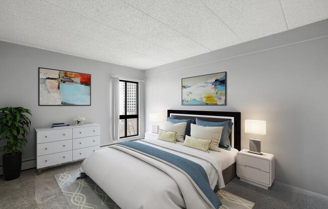 a bedroom with a bed and a dresser at Troy Place Apartments - Troy, MI, Troy, Michigan