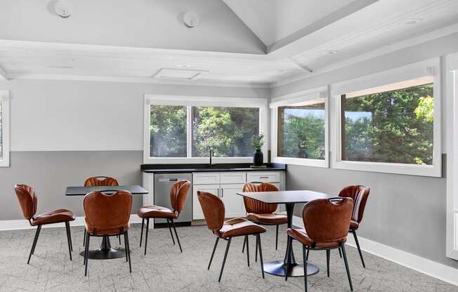 a dining room with a table and chairs