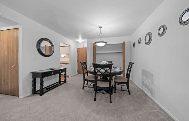 Cozy dining room connected to kitchen at Westwood Village Apartments in Westland, MI