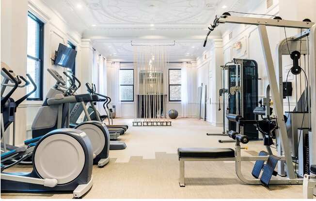 A fitness center with treadmills, elliptical machines, and weightlifting equipment at Grand Wisconsin, Wisconsin