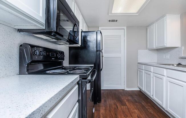 a large kitchen with stainless steel appliances