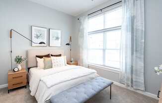 One Wall Street Bedroom Bed with large open windows and sunlight