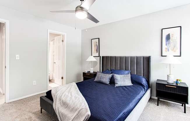 a bedroom with a large bed and a ceiling fan at Parc at 1875, College Park, Georgia