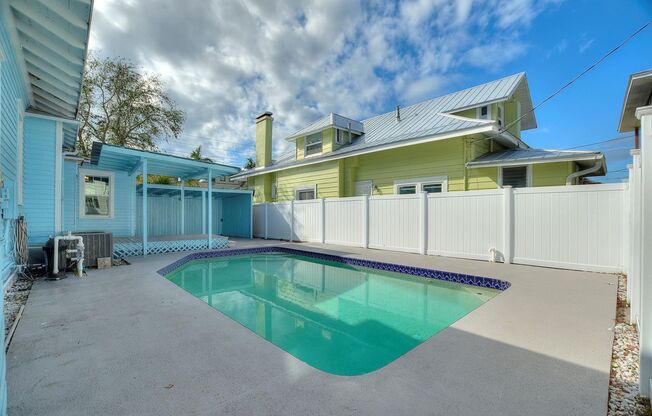 Stunning 3-Bedroom, 3-Bath Corner Single Family Home with Pool and Bonus Room in Premier St. Petersburg Location!