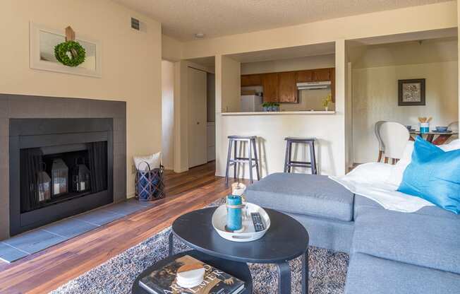 Enclave living room with cozy couches and wood-like flooring