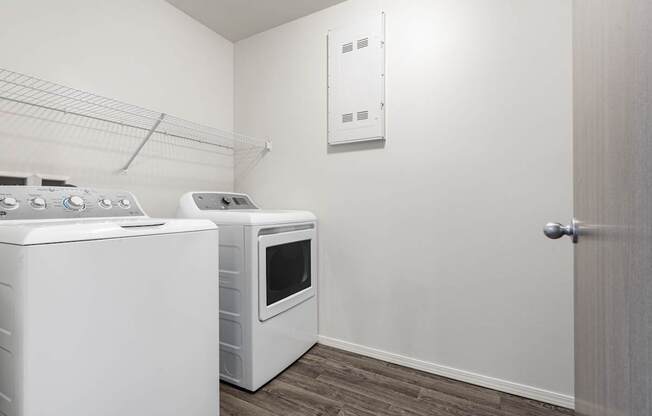 A white oven and microwave in a kitchen.