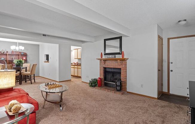 a living room with a fireplace and a couch