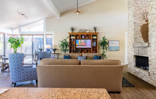 A living room with a fireplace and a couch.