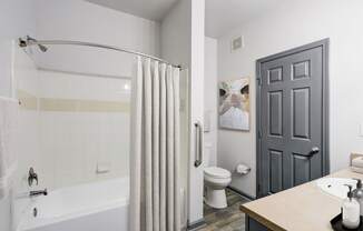 Parc at Metro Center Apartments near Buena Vista Heights, TN photo of a bathroom with a shower and a toilet and a sink