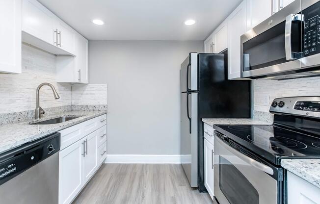 a modern kitchen with stainless steel appliances