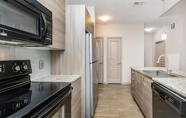 a modern kitchen with stainless steel appliances