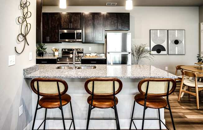 Kitchen with stunning countertops at Sterling Prairie Trail North in Ankeny, IA