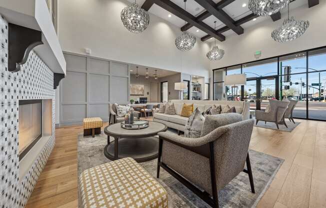 a living room with couches and chairs and a fireplace