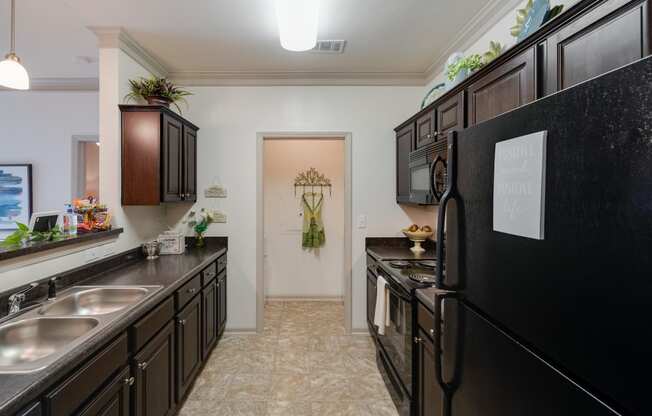 Galley Kitchen With Tiled-Style Flooring