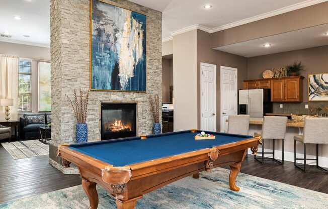 Cordillera Ranch Apartments billiards table and indoor fireplace