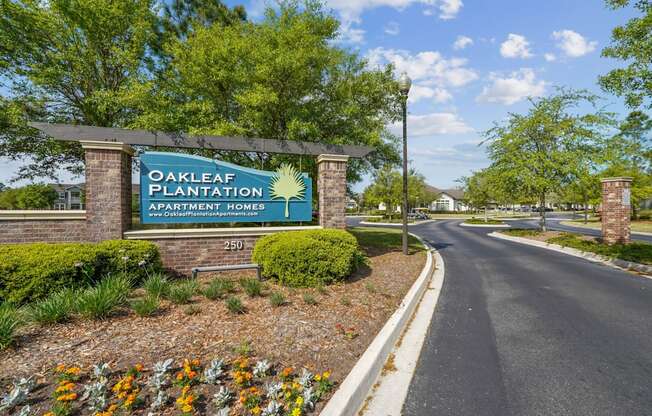 Property sign for Oakleaf Plantation Apartment Homes at the community entrance in Jacksonville, FL