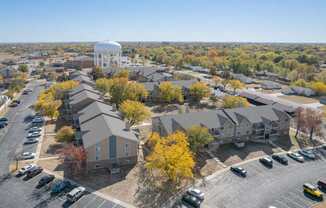 an aerial view of a neighborhood with houses and a water tower