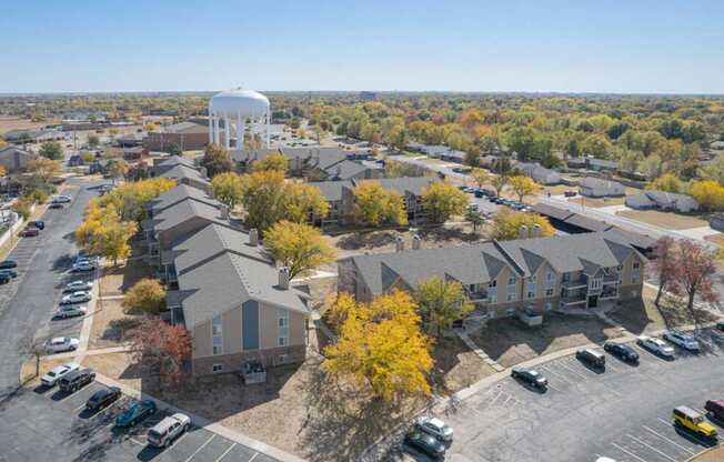 an aerial view of a neighborhood with houses and a water tower