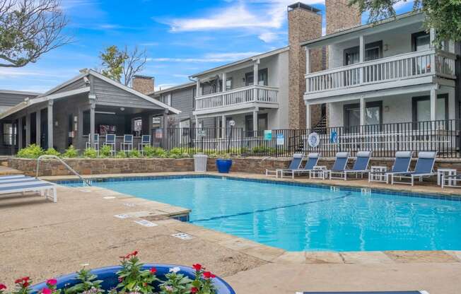 our apartments have a large swimming pool with lounge chairs