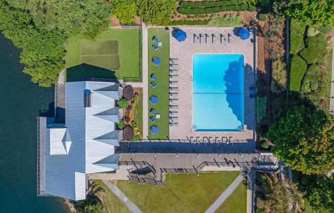 an aerial view of a house and a swimming pool