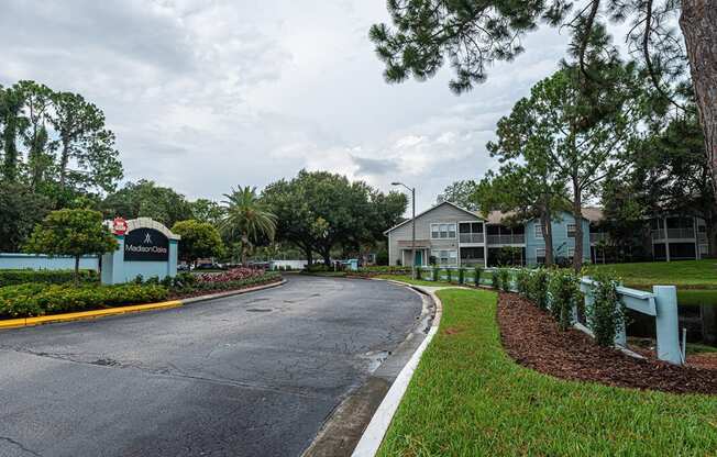 a street in a neighborhood with houses and trees