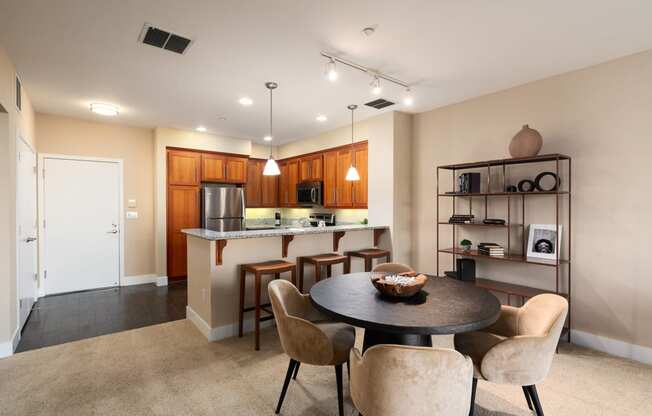 an open kitchen and dining room with a table and chairs