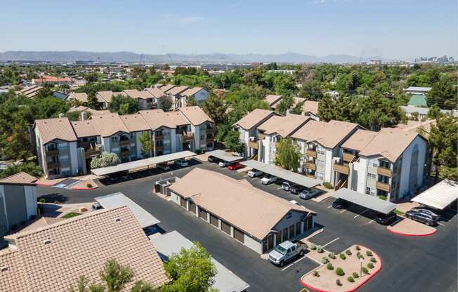 an aerial view of a group of houses in a parking lot