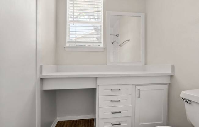 a small bathroom with a sink and a mirror