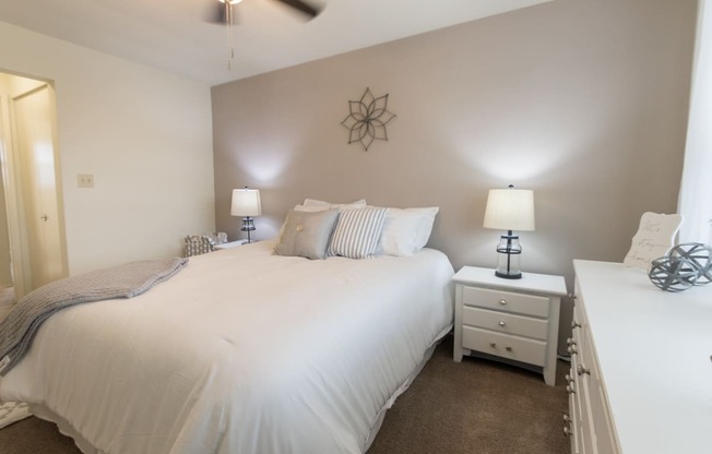 This is a photo of the bedroom of the 1 bedroom, 631 square foot model apartment at Lake of the Woods Apartments in Cincinnati, OH.