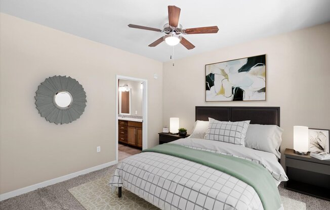 a bedroom with a bed and a ceiling fan