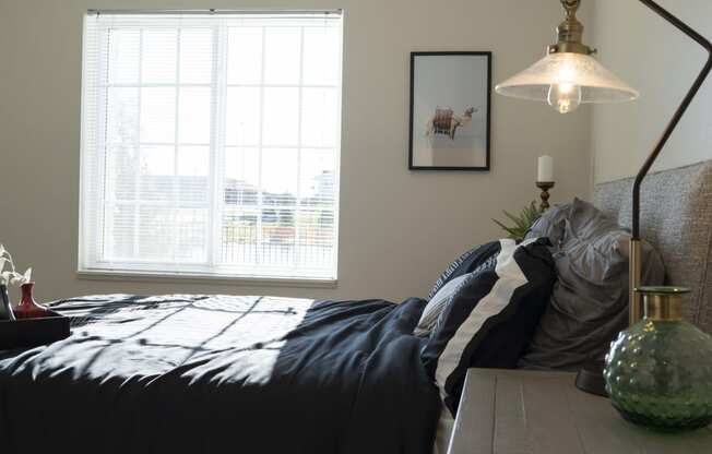 Bedroom with queen size bed and large window