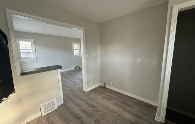 2 bed 1 bath recently refinished corner home with new kitchen, bathroom, and floors!