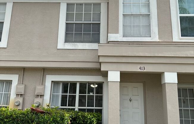 Beautiful Townhome in a gated community with assigned parking spots and a community pool