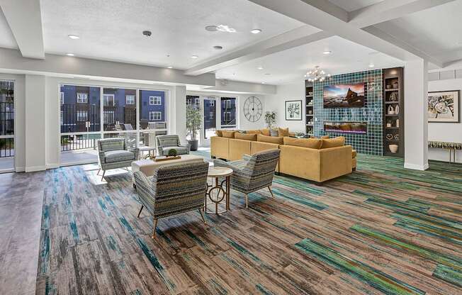 a living room with couches and chairs and a fireplace