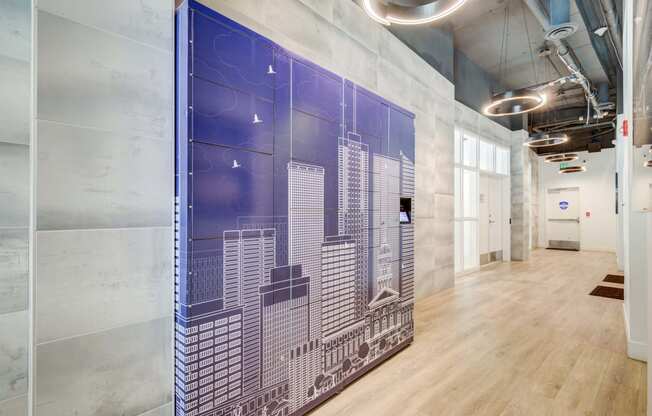 a large mural of a city on the wall of a hallway