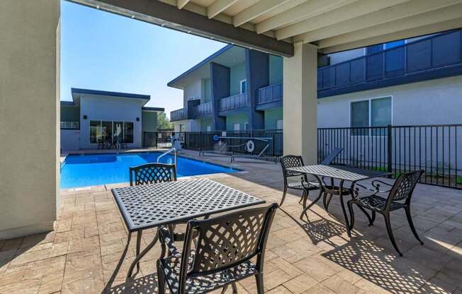 The Hedrick on Mountain Townhome-Style Apartments in Tucson, Arizona Pool with Lounge Chairs