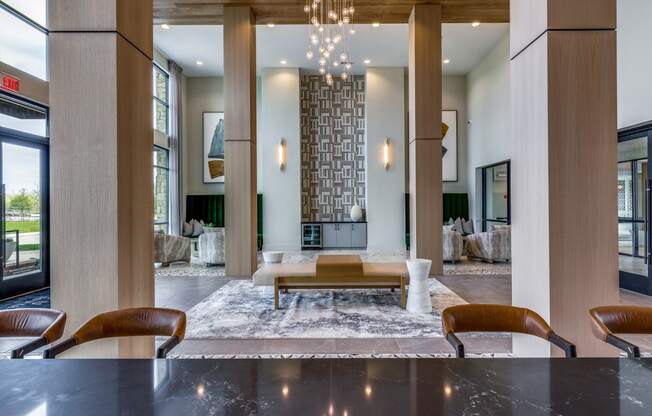 a living room with a fireplace and a table and chairs