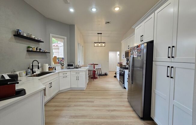 STUNNING GOLF COURSE AND WATER VIEWS IN GUARD-GATED SPANISH TRAIL!