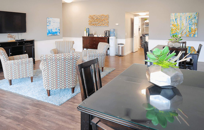 a dining room and living room with a table and chairs