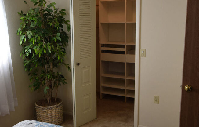 Bedroom with Walk In Closet at Canal Club Apartments, Lansing, MI