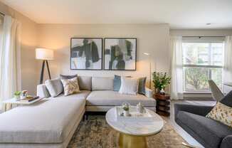 a living room with a couch and a coffee tableat Ashford Green, Charlotte, North Carolina 28262