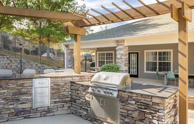 A stone wall with a grill on it.