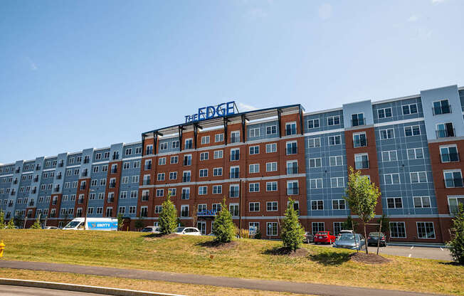 The Edge apartment building is a multi-story structure with a mix of brick and glass facades.