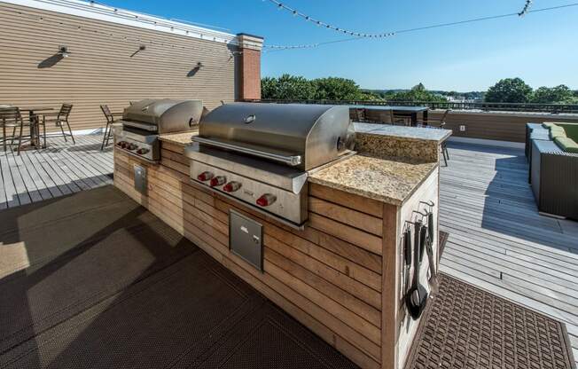 Grills on community roof deck | The Merc at Moody and Main