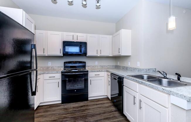 Apartments for Rent in Leander TX - Hills at Leander Spacious Kitchen with Plenty of Counterspace, Fully Equipped with Black Appliances, and Much More