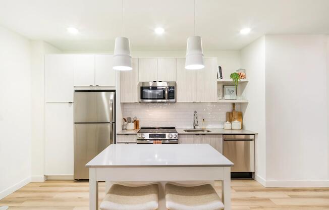 A streamlined kitchen with clean lines, ample storage, and a flexible island for everyday dining.