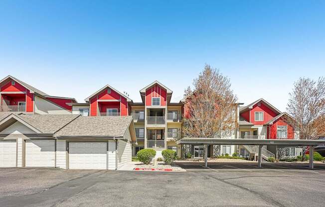 A row of houses with a clear blue sky above them.